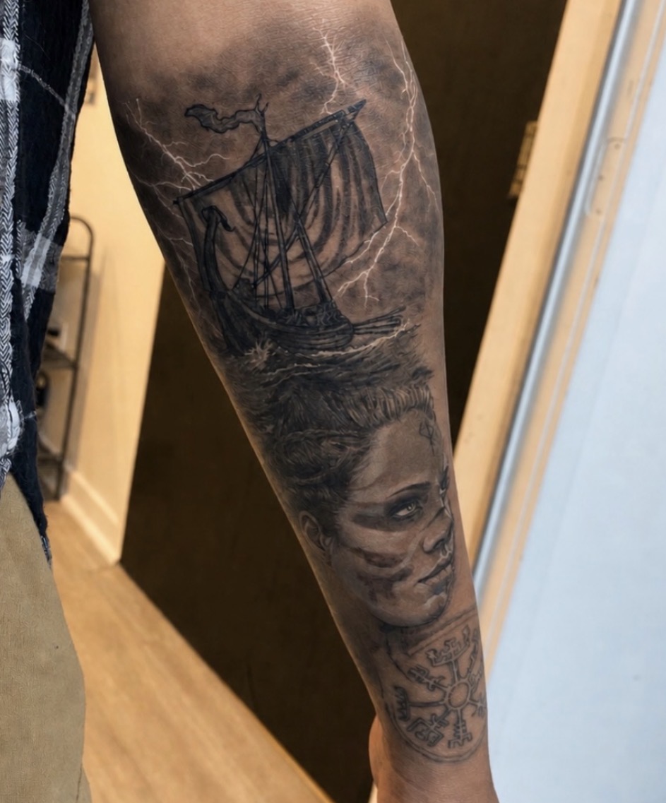 Viking ship and portrait tattoo by Jake Bebout at Snafu Tattoo Studio in Wilmington NC