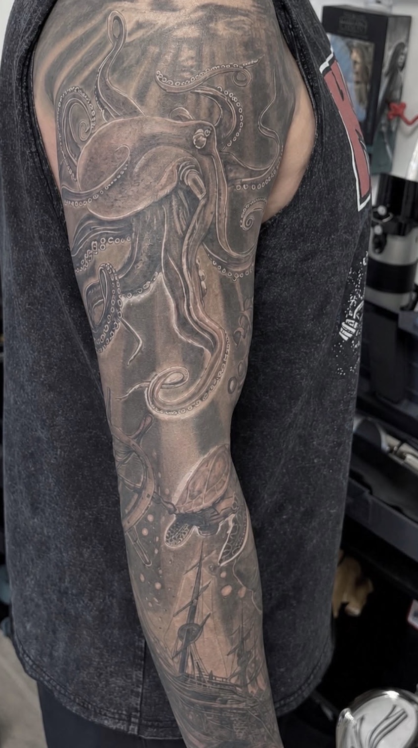 Octopus sleeve tattoo by Jake Bebout at Snafu Tattoo Studio in Wilmington NC