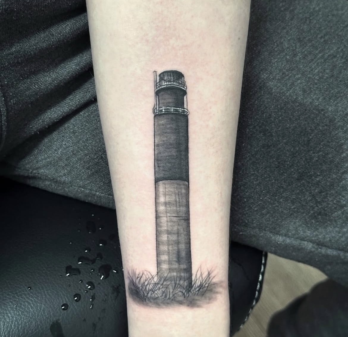 Lighthouse tattoo by Jake Bebout at Snafu Tattoo Studio in Wilmington NC